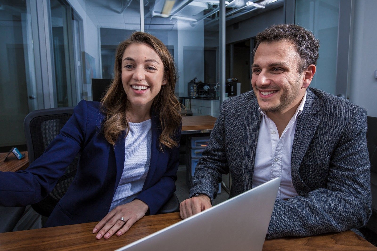 CommonLit's CEO and CSO smile in an office. 