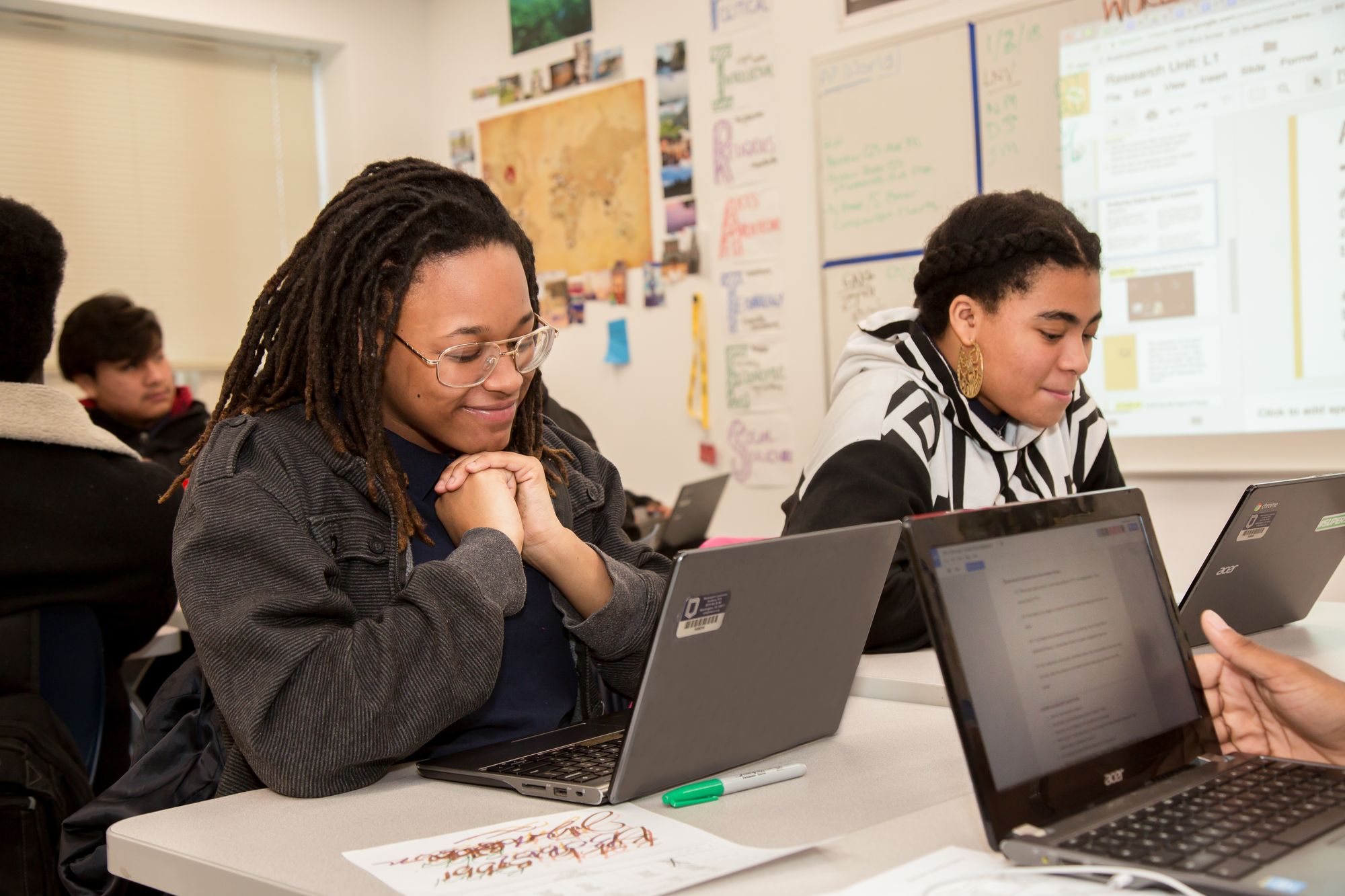 Students reading a historical letter from the CommonLit library