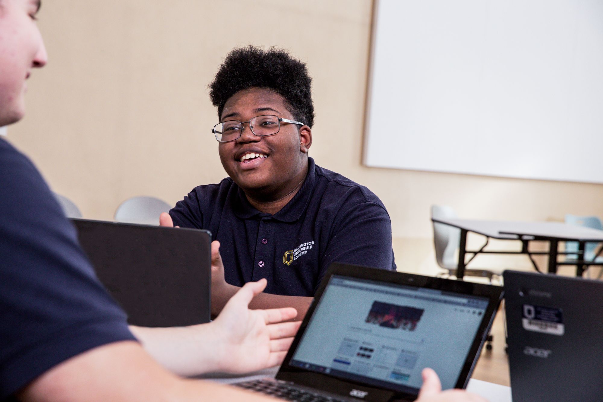 Students complete a CommonLit lesson on laptops. 