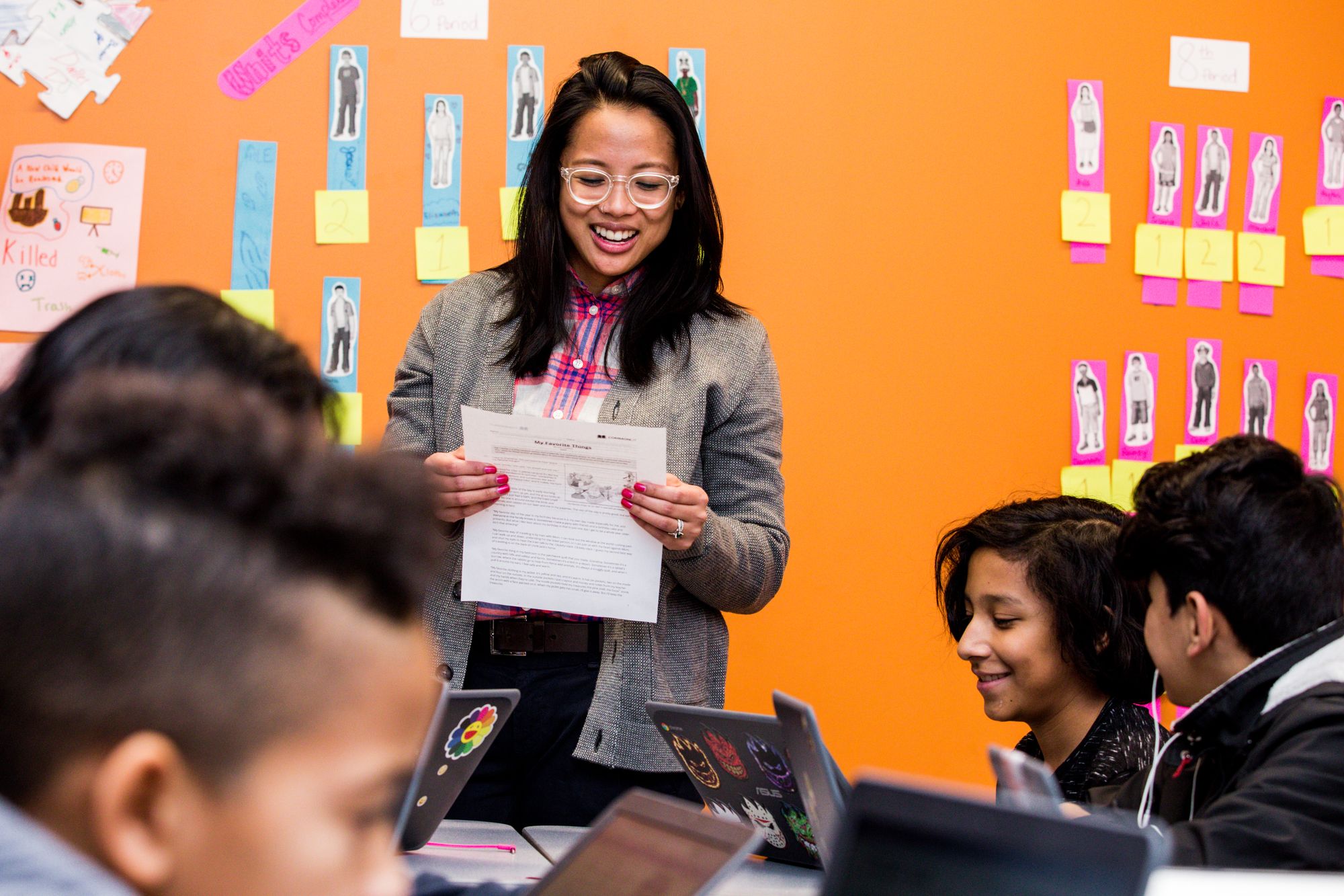 A teacher discusses a text with students.