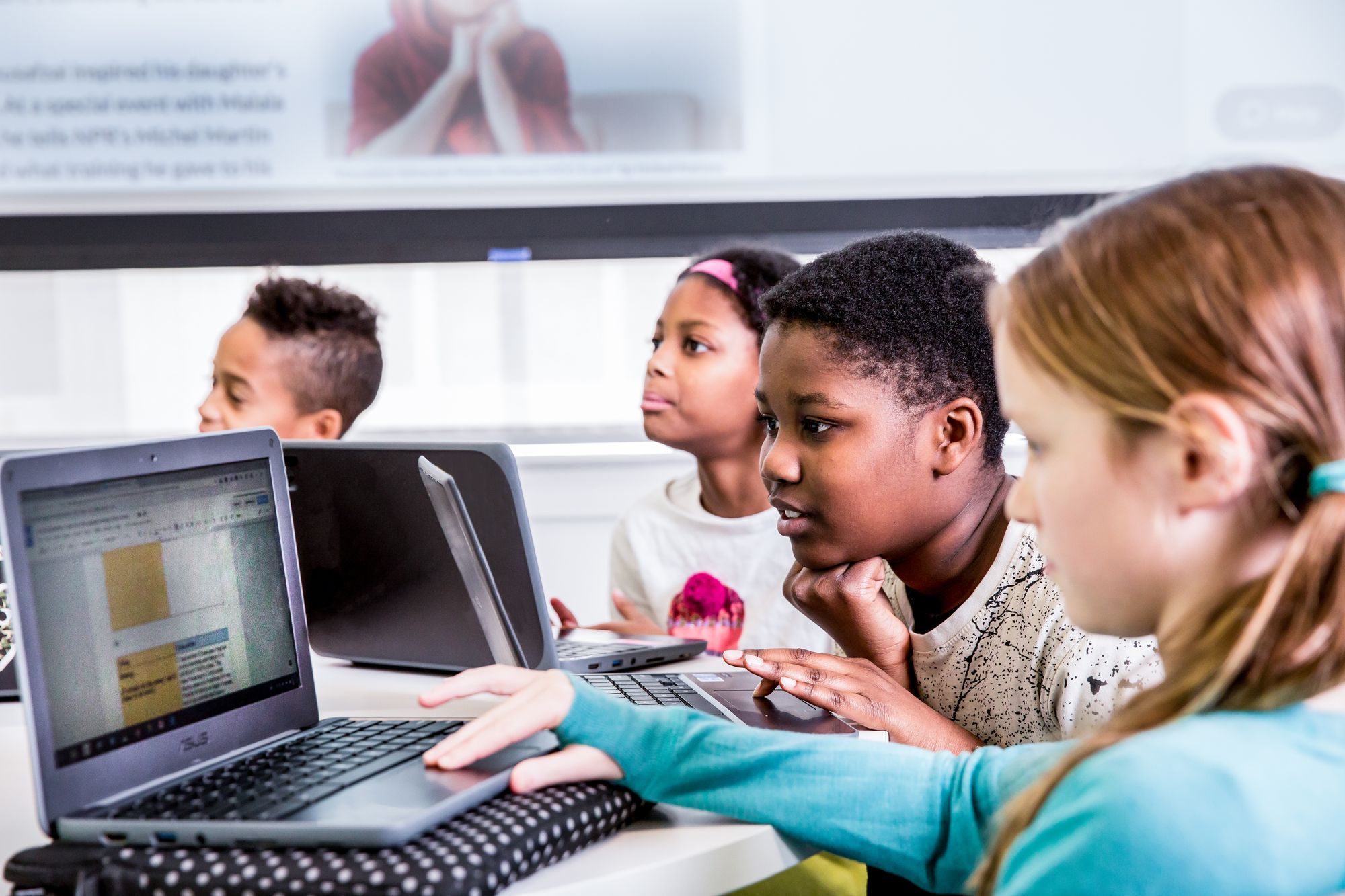 Four students engage with a CommonLit lesson 