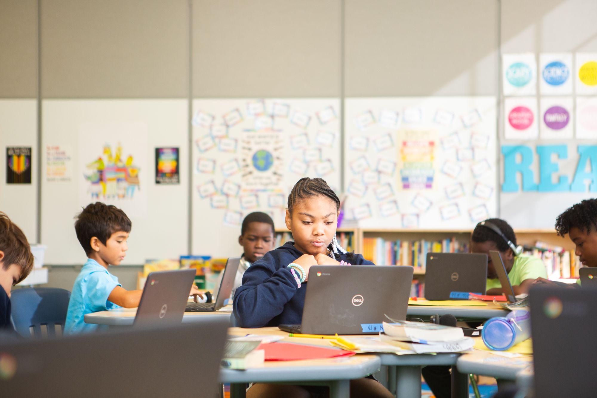 Young students work on a digital CommonLit lesson.