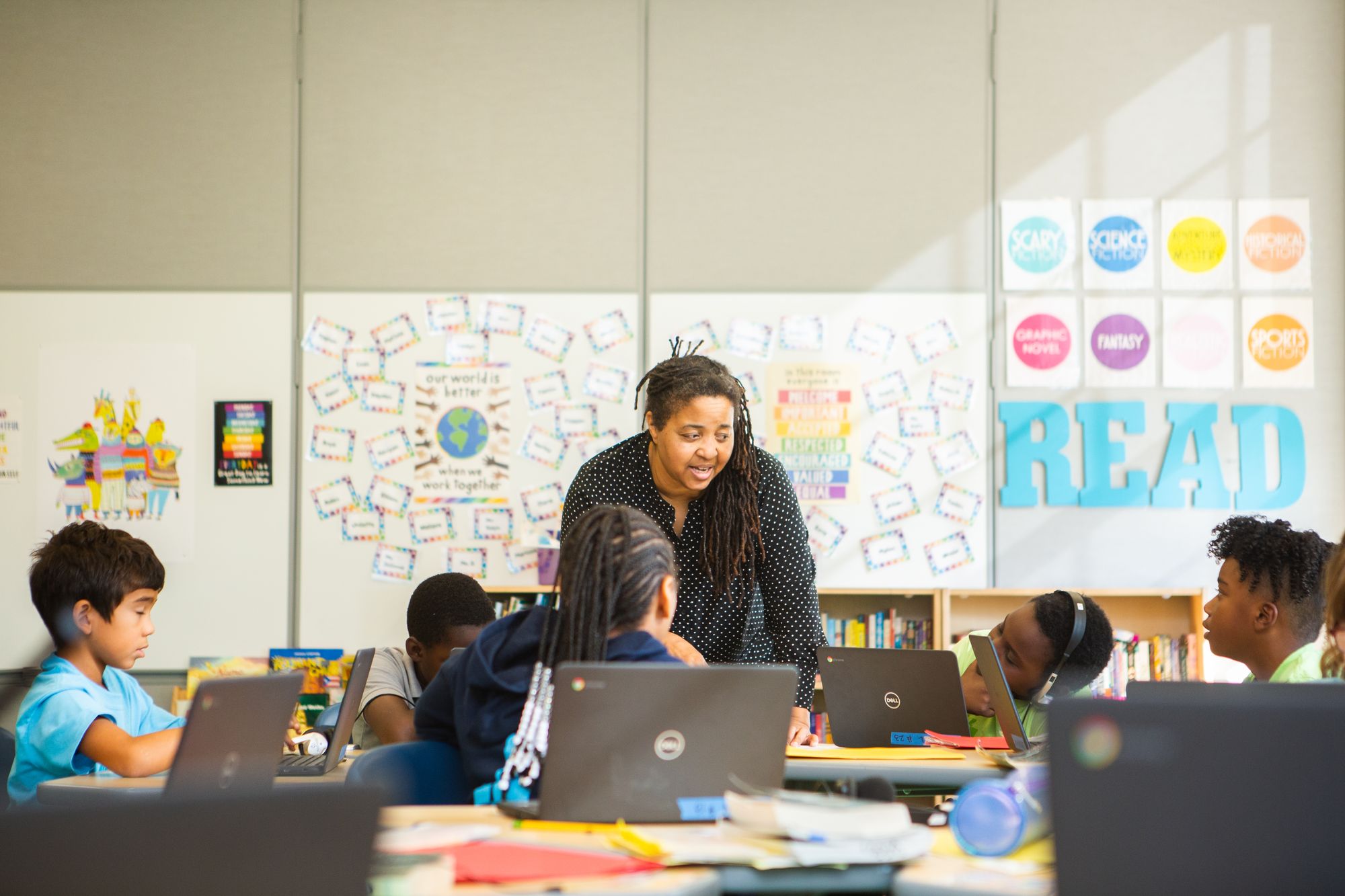 Teacher helping students with a CommonLit Target Lesson