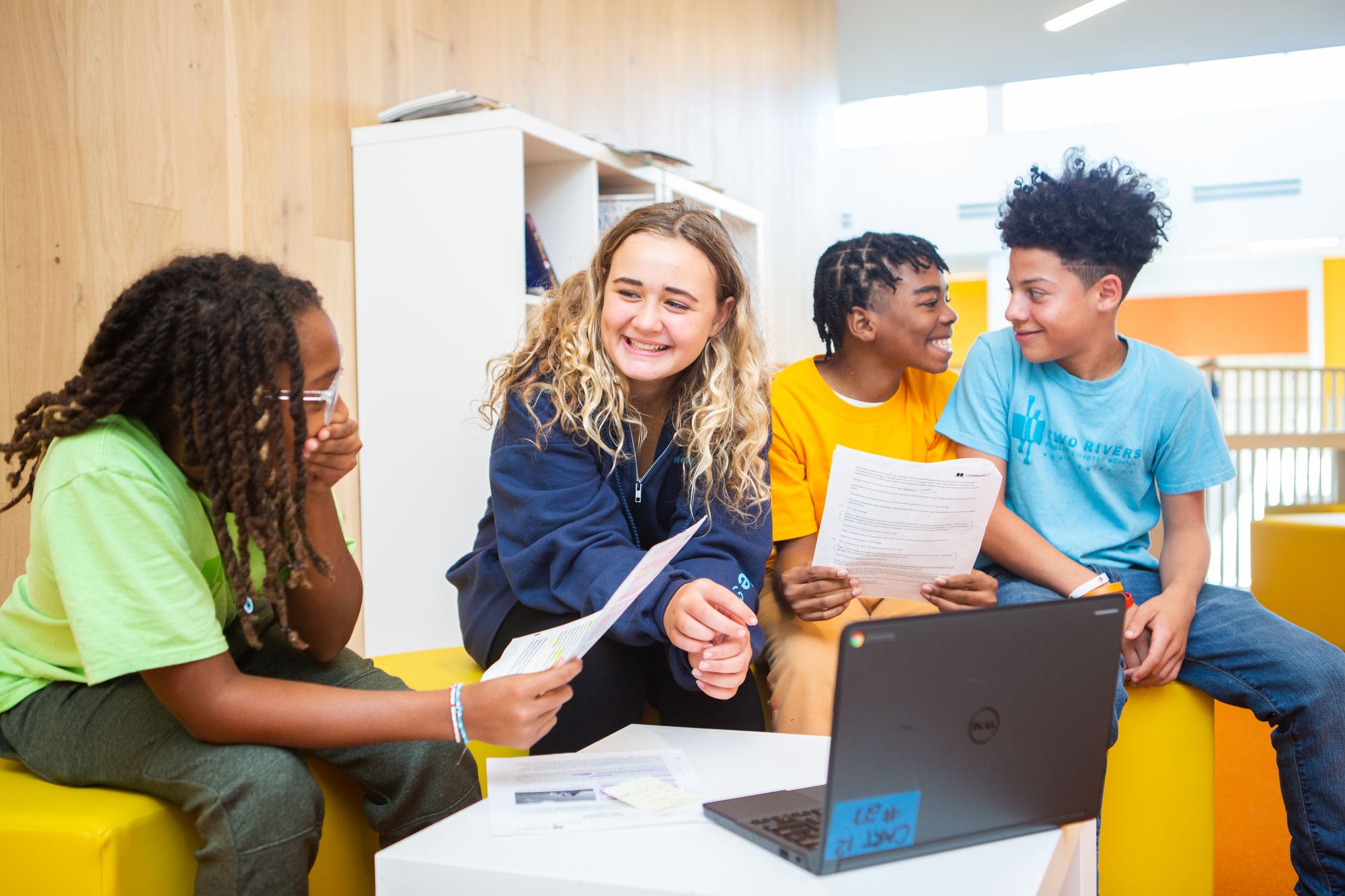 Four students sit around a table as they work on a CommonLit Target Lesson.